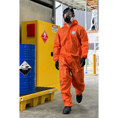 man in orange chemical coverall wearing a full face respirator