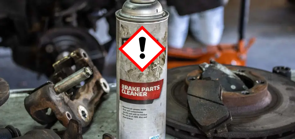 exclamation diamond over a can of brake parts cleaner with organic solvents