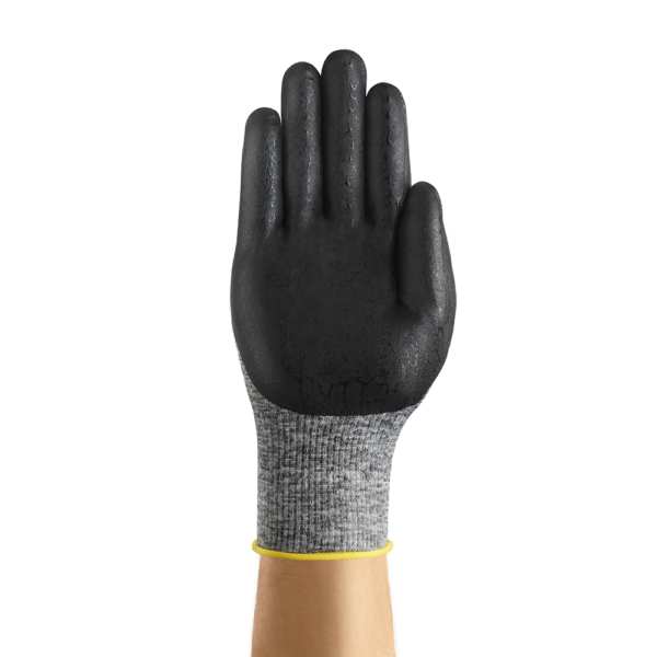 Rear view of Ansell HyFlex 11-801 glove showing black nitrile palm coating and grey knit cuff with yellow trim, palm facing camera.