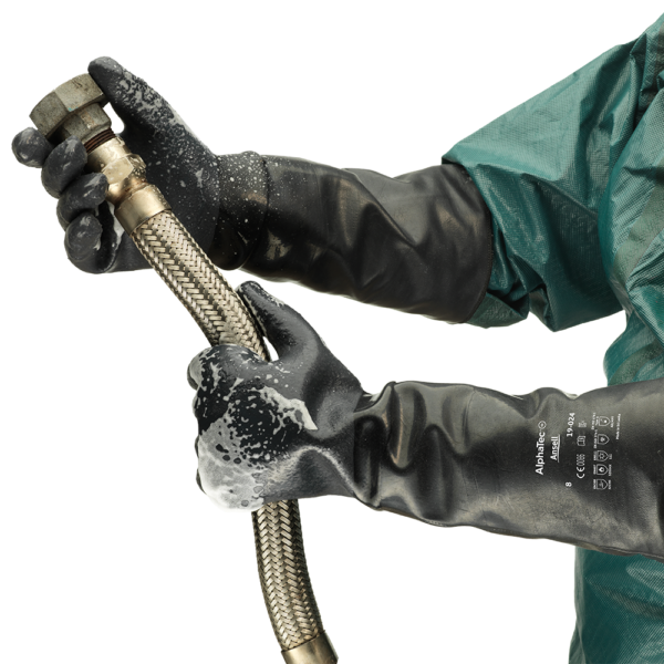 Ansell AlphaTec 19-024 gloves in use during industrial hose handling with chemical foam present.