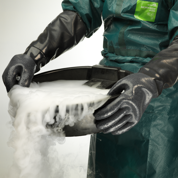 AlphaTec 19-024 gloves protecting hands while pouring hazardous steaming liquid in a controlled environment.
