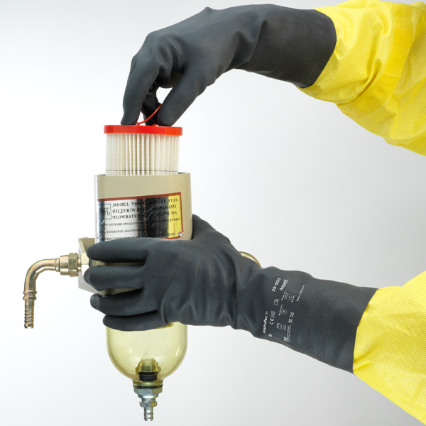 Worker wearing AlphaTec 29-500 gloves during maintenance task, demonstrating protection for chemical handling