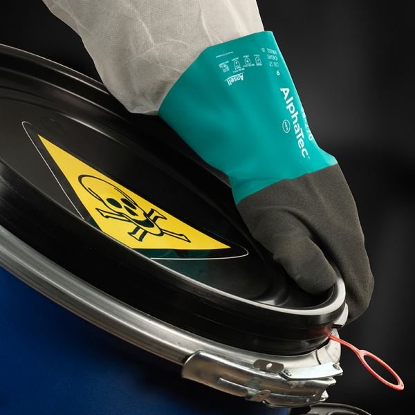 AlphaTec 58-270 glove safely handling toxic drum lid with seal tag