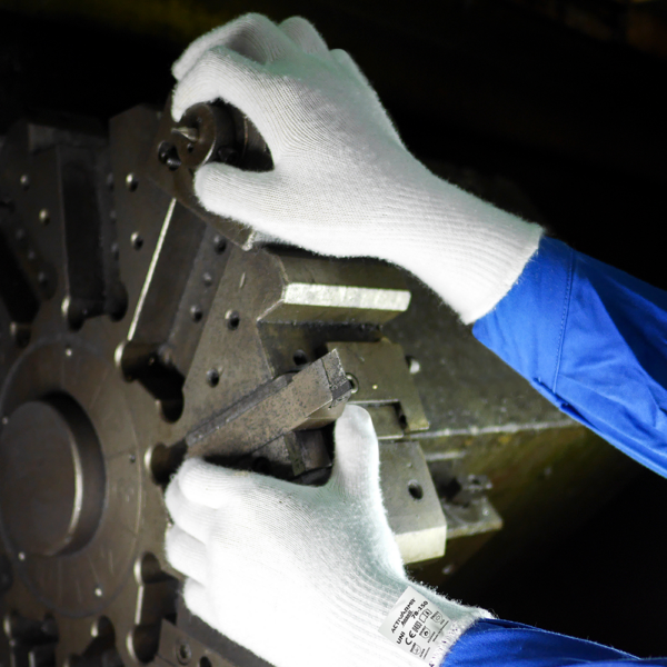 Ansell ActivArmr 78-150 gloves worn while adjusting metal lathe machinery in industrial setting
