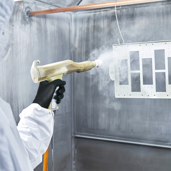 Worker wearing Microflex 93-852 gloves during spray painting in a controlled booth