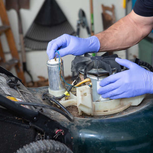 Microflex 93-853 gloves worn during mechanical repair work, showing safe handling of engine components