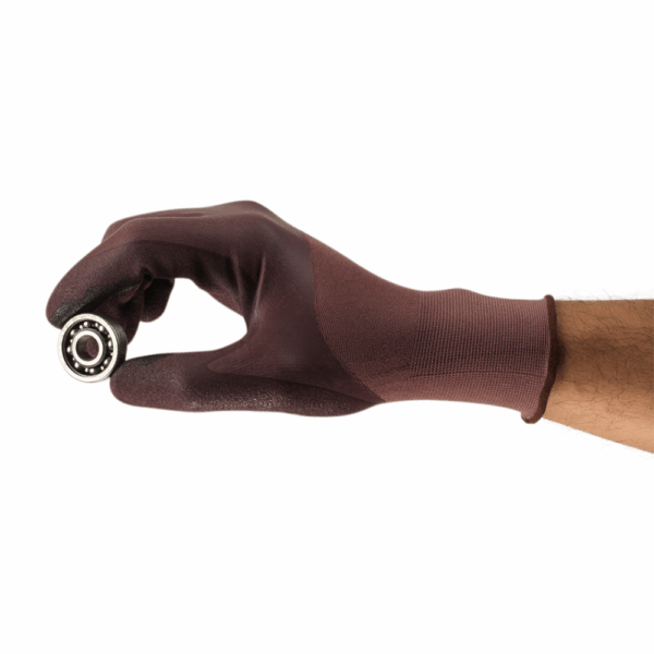 Ansell HyFlex 11-926 glove holding a small metal bearing