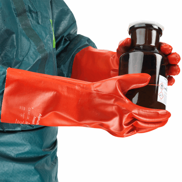 Worker wearing Ansell AlphaTec 15-554 gloves holding chemical bottle