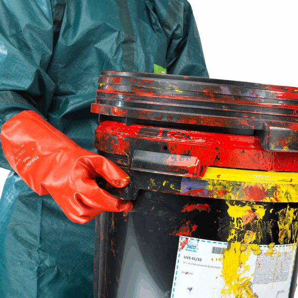 Worker wearing Ansell AlphaTec 15-554 gloves handling paint-covered container