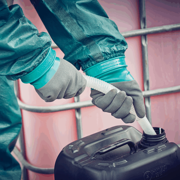 AlphaTec chemical resistant gloves providing grip and protection while transferring liquids from hose to container