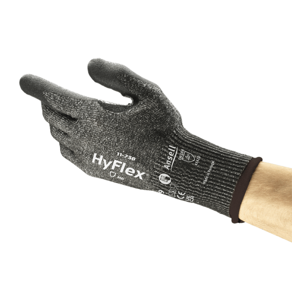 Ansell HyFlex 11-738 protective glove angled view – lightweight grey and black knit for precision handling and cut protection.