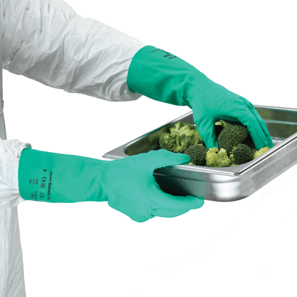 Ansell AlphaTec Solvex 37-145 gloves used for handling food trays – safe for food contact and resistant to cleaning chemicals.